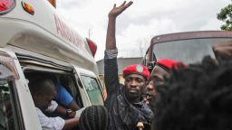 Ugandan singer-turned-politician Robert Kyagulanyi (C), better known as Bobi Wine, reacts as he gets into an ambulance after being released on bail at The High Court in Gulu, northern Uganda, on August 27, 2018. - Ugandan singer-turned-politician Robert Kyagulanyi, better known as Bobi Wine, has been released on bail after two weeks in detention. Kyagulanyi and 33 others, including two fellow serving MPs, are facing treason charges in a case that has triggered an international outcry. 