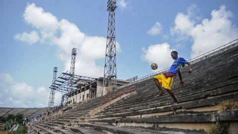 A Somali boy handles a ball at the Mogadishu stadium after African Union forces left the stadium on August 28.