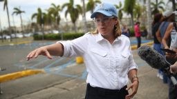 SAN JUAN, PUERTO RICO - SEPTEMBER 30:  San Juan Mayor Carmen Yulin Cruz speaks to the media as she arrives at the temporary government center setup at the Roberto Clemente stadium in the aftermath of Hurricane Maria on September 30, 2017 in San Juan, Puerto Rico.  Puerto Rico experienced widespread damage including most of the electrical, gas and water grid as well as agriculture after Hurricane Maria, a category 4 hurricane, passed through.  (Photo by Joe Raedle/Getty Images)