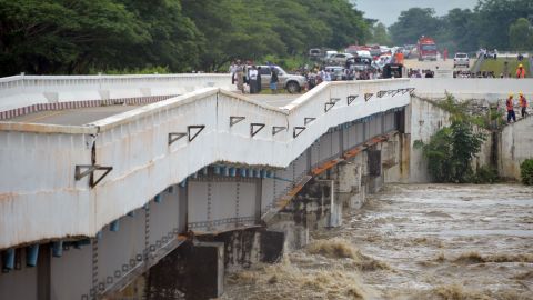 A major bridge along the Yangon-to-Mandalay highway, which connects with Myanmar's capital, Naypyidaw, is seen damaged Wednesday by rampaging floodwaters from a burst dam.