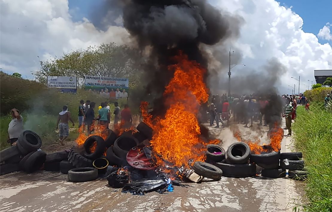 Residents of the Brazilian border town of Pacaraima burn tires and belongings of Venezuelans immigrants after attacking their two main makeshift camps, leading them to cross the border back into their home country earlier in August.