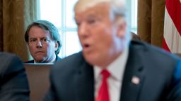 FILE- In this Aug. 16, 2018, file photo White House counsel Donald McGahn, left, listens as President Donald Trump speaks during a cabinet meeting in the Cabinet Room of the White House in Washington. Trump insisted Sunday, Aug. 19, that McGahn isn't "a John Dean type 'RAT,'" making reference to the Watergate-era White House attorney who turned on Richard Nixon. Trump, in a series of angry tweets, blasted a New York Times story reporting that McGahn has been cooperating extensively with the special counsel team investigating Russian election meddling and potential collusion with Trump's Republican campaign. (AP Photo/Andrew Harnik, File)