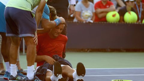 Mikhail Youzhny of Russia struggled with heat exhaustion during a match at the US Open. 