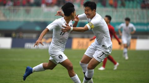 South Korea's Lee Seung-woo (L) celebrates with teammate Son Heung-min (R) after scoring against Vietnam.