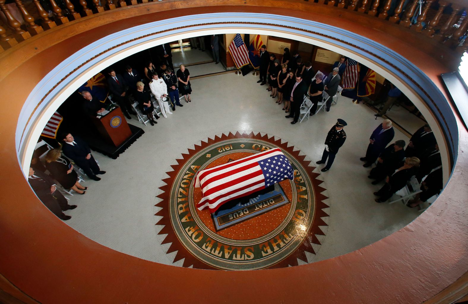 People stand during Wednesday's memorial service. In the last 40 years, only two other people have lain in state at the State Capitol: state Sen. Marilyn Jarrett in 2006, and Olympic gold medalist Jesse Owens in 1980.