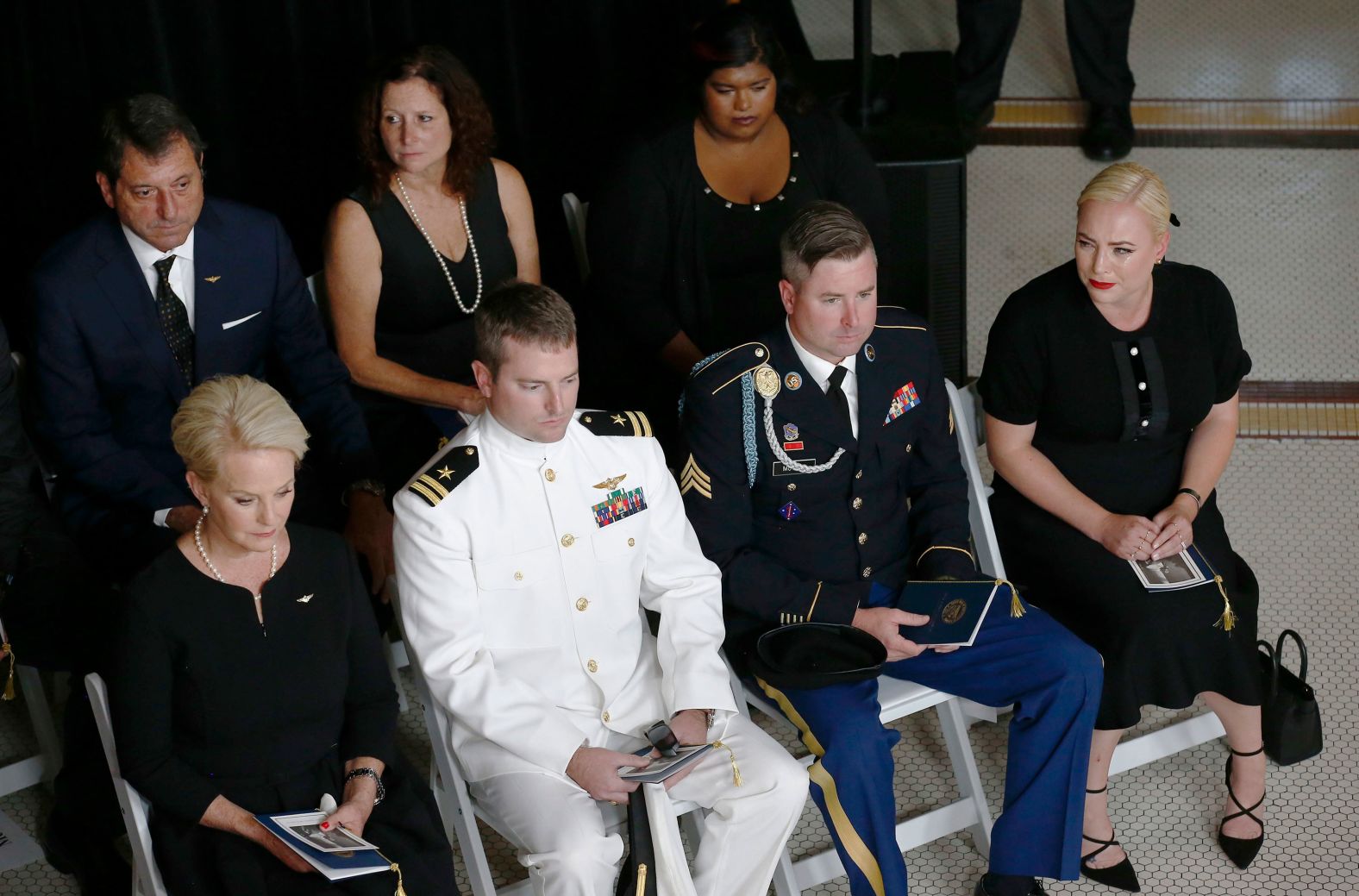 Cindy McCain, front left, sits with her children Jack, Jimmy and Meghan during the service in Phoenix. From left to right in the second row are Doug and Sidney, John McCain's children from his first marriage, and the McCains' adopted daughter, Bridget.