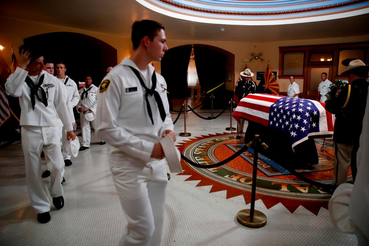 US naval cadets walk past McCain's casket on Wednesday.