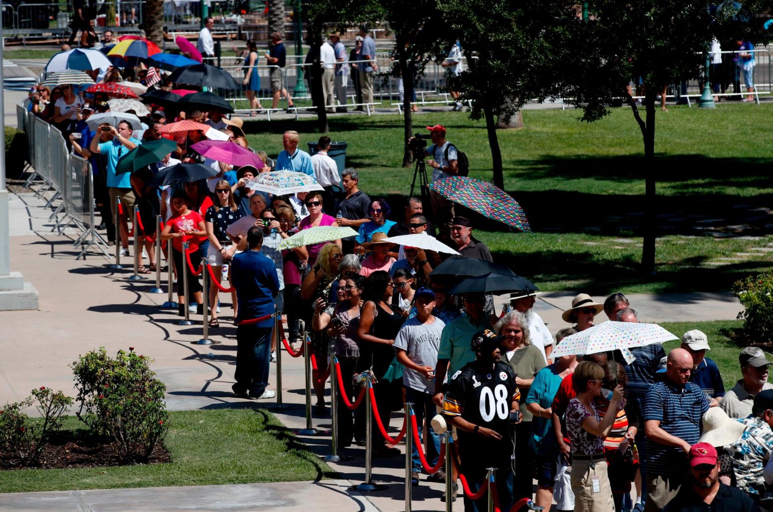 People wait in line for their chance to pay their respects at the Arizona State Capitol.