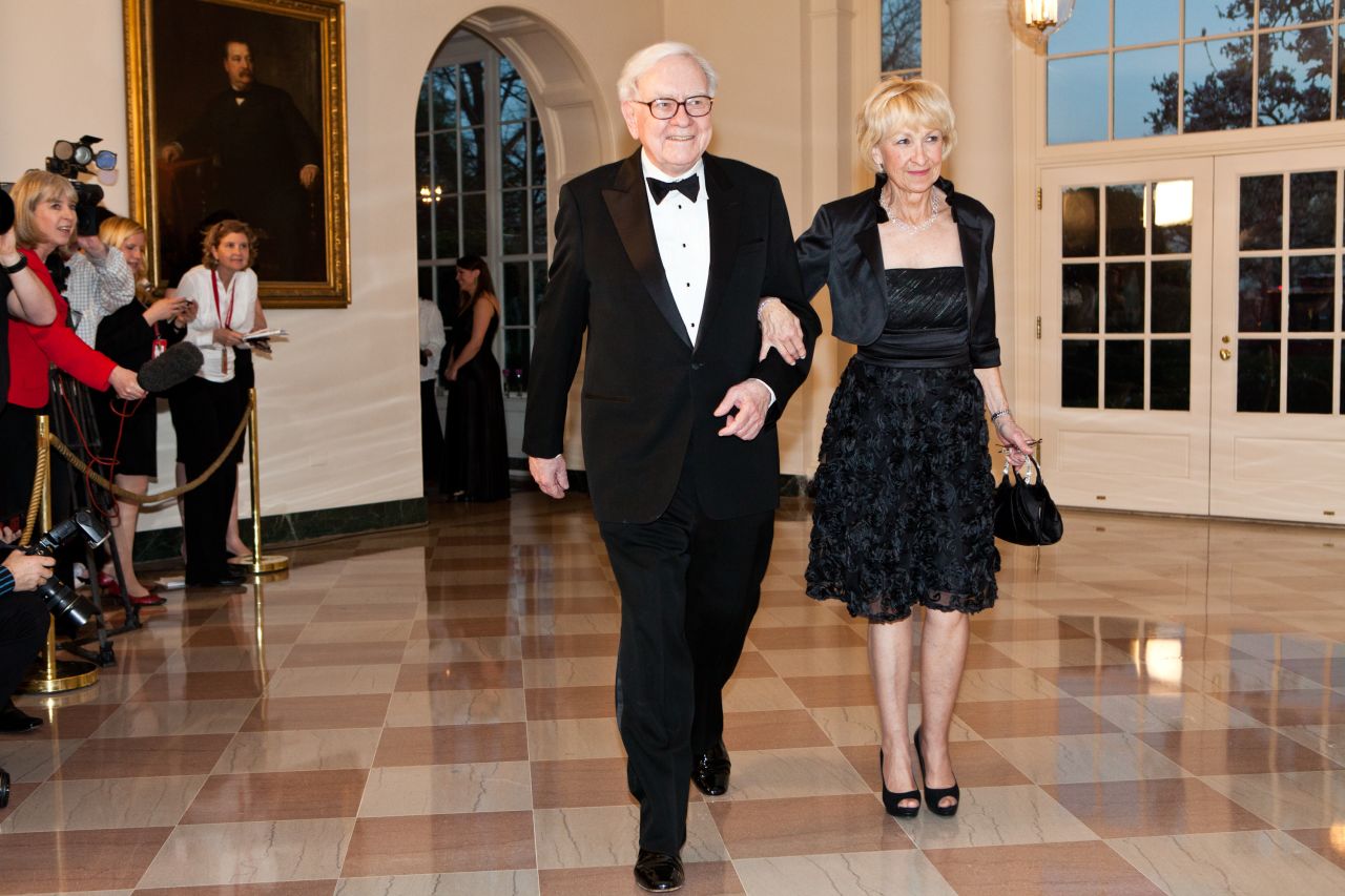 Buffett and his second wife, Astrid, arrive at the White House for a state dinner honoring British Prime Minister David Cameron in 2012. The next month, Buffett confirmed that he had been diagnosed with Stage 1 prostate cancer. He underwent radiation treatments and told Berkshire Hathaway shareholders that the cancer was "not remotely life-threatening."