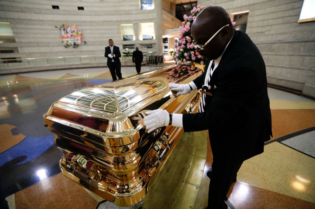 Vincent Street wipes down Franklin's casket on Wednesday.