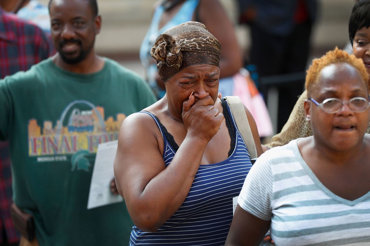 A fan is overcome with emotion at the Charles H. Wright Museum of African American History.