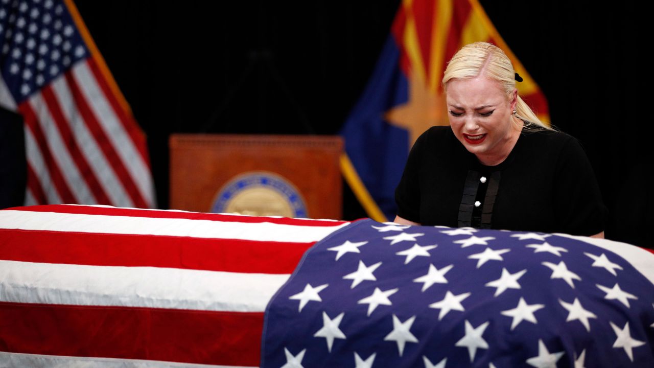Meghan McCain, daughter of US Sen. John McCain, cries at her father's casket during a <a href="https://www.cnn.com/2018/08/29/politics/gallery/mccain-memorials/index.html" target="_blank">memorial service in Phoenix</a> on Wednesday, August 29.