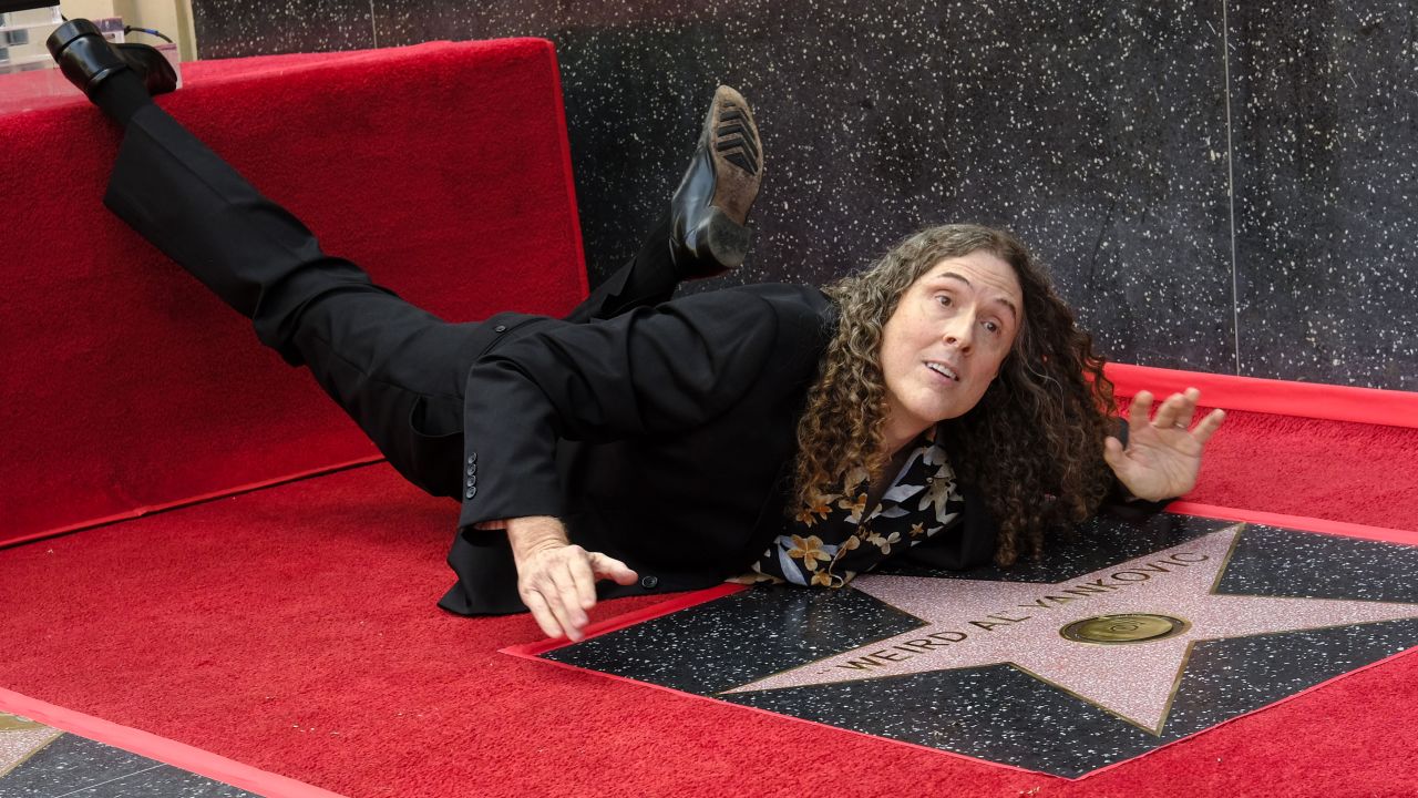 Comedic singer "Weird" Al Yankovic hams it up as he receives a star on the Hollywood Walk of Fame on Monday, August 27.