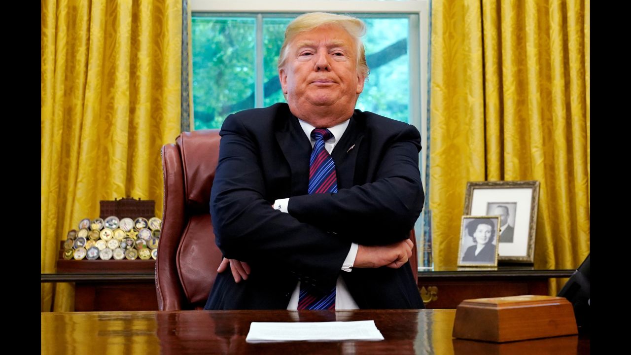 US President Donald Trump sits behind his desk as he <a href="https://www.cnn.com/2018/08/27/politics/mexico-us-trade-deal/index.html" target="_blank">announces a bilateral trade agreement with Mexico</a> on Monday, August 27. The two countries reached an agreement to change parts of NAFTA, the trade deal that Trump has derided for years as unfair. Mexican President Enrique Peña Nieto was dialed in on a conference call.