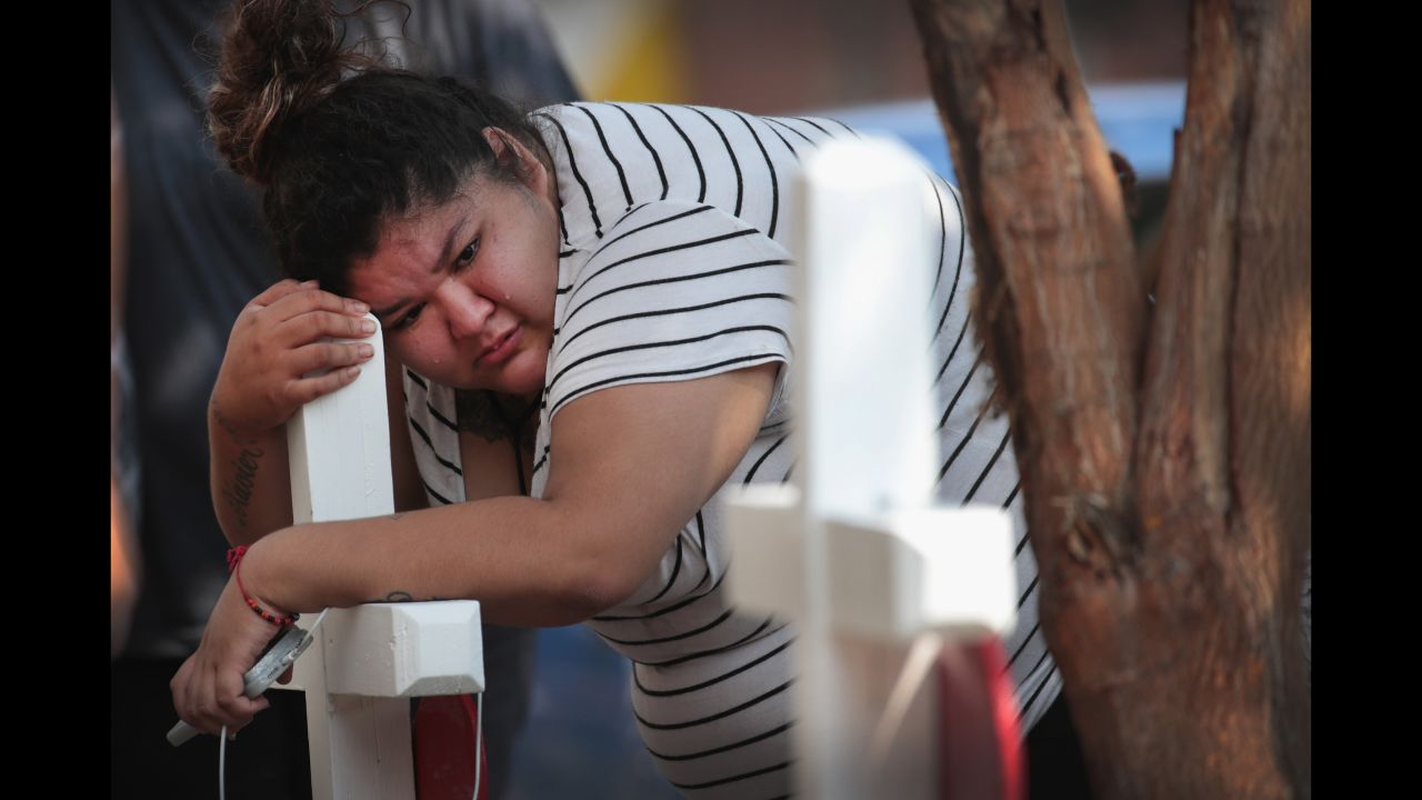 Amber Ayala mourns after <a href="https://www.cnn.com/2018/08/28/us/chicago-fire-deaths-investigation/index.html" target="_blank">an early morning house fire killed 10 children</a> who had gathered for a slumber party in Chicago on Sunday, August 26.
