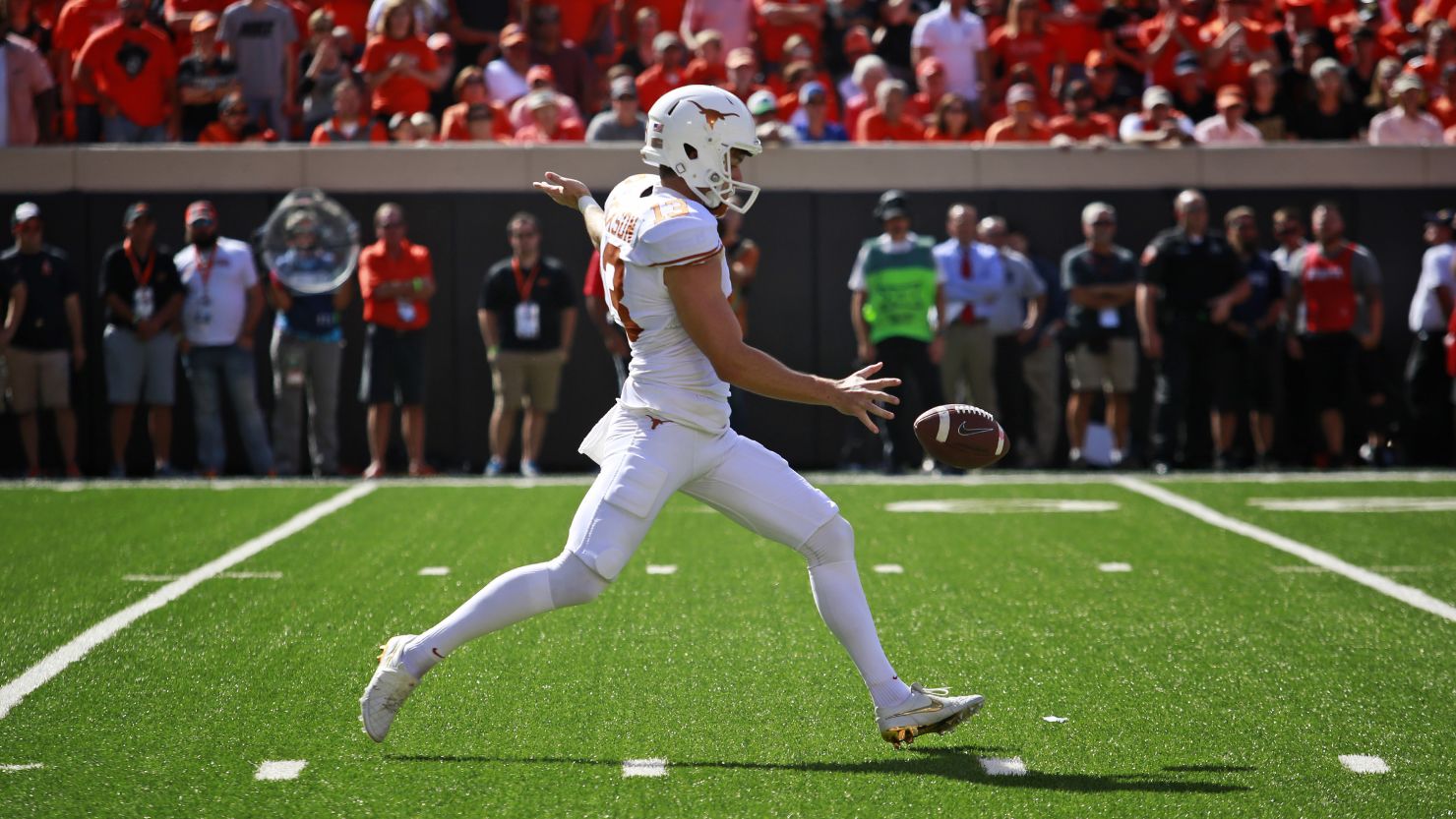 Punter Michael Dickson in action for the Texas Longhorns against the Oklahoma State Cowboys.