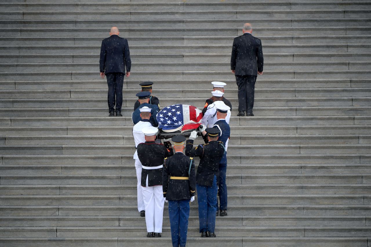 McCain's casket is carried up the Capitol steps. A storm broke out <a href="https://www.cnn.com/politics/live-news/mccain-funeral/h_950294275d21902551c36cb98f614e57" target="_blank">at the very moment</a> McCain's casket was carried in.