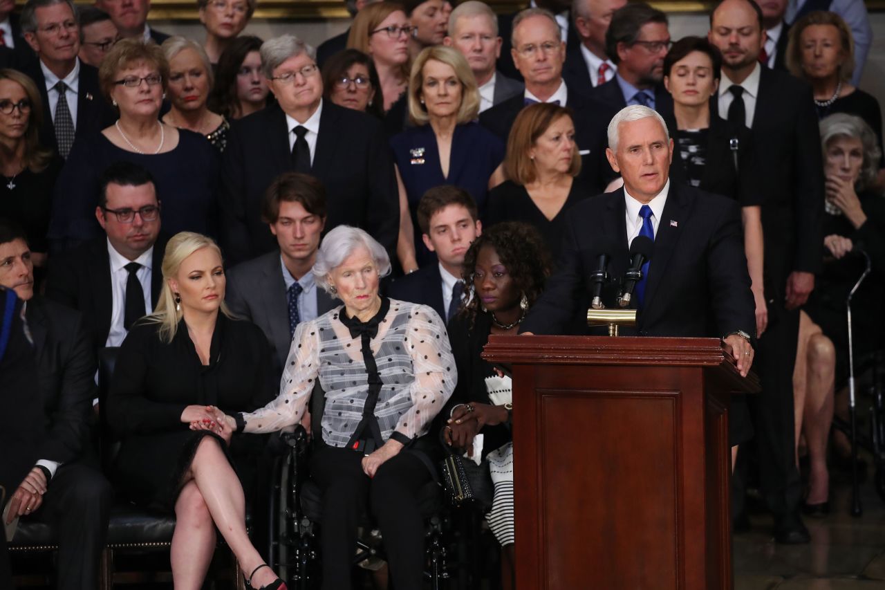 Vice President Mike Pence delivers remarks at the US Capitol ceremony on Friday. To Pence's right are McCain's 106-year-old mother, Roberta, and McCain's daughter Meghan. "Let me say to all those gathered and his beloved family: On behalf of a grateful nation, we will ever remember that John McCain served his country and John McCain served his country honorably,"  Pence said.