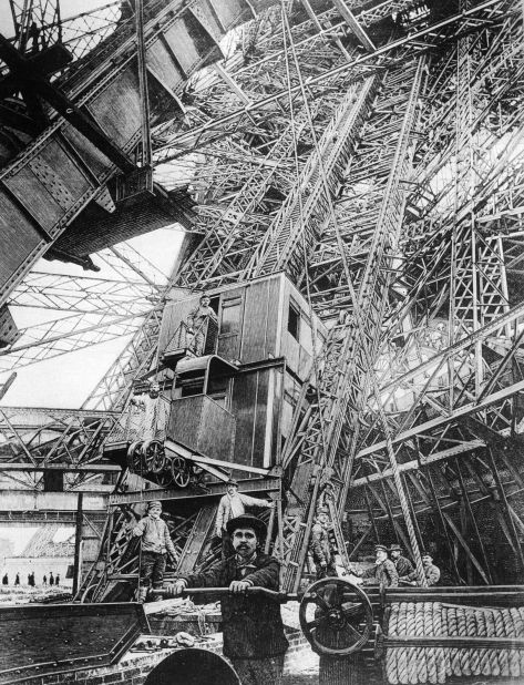 The elevator at the first level of the Eiffel Tower, during its construction in 1889. The elevator is still used for conveying sightseers. 