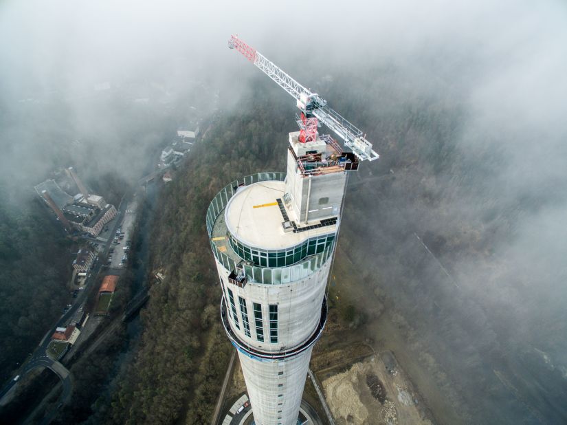 An aerial view of the elevator testing tower of Thyssenkrupp Elevator in Rottweil, Germany. The tower, at 246 meters tall, includes 12 shafts for testing elevators and their components and can test elevators at speeds of up to 18 meters per second. At 232 meters, it is also Germany's highest viewing platform. 