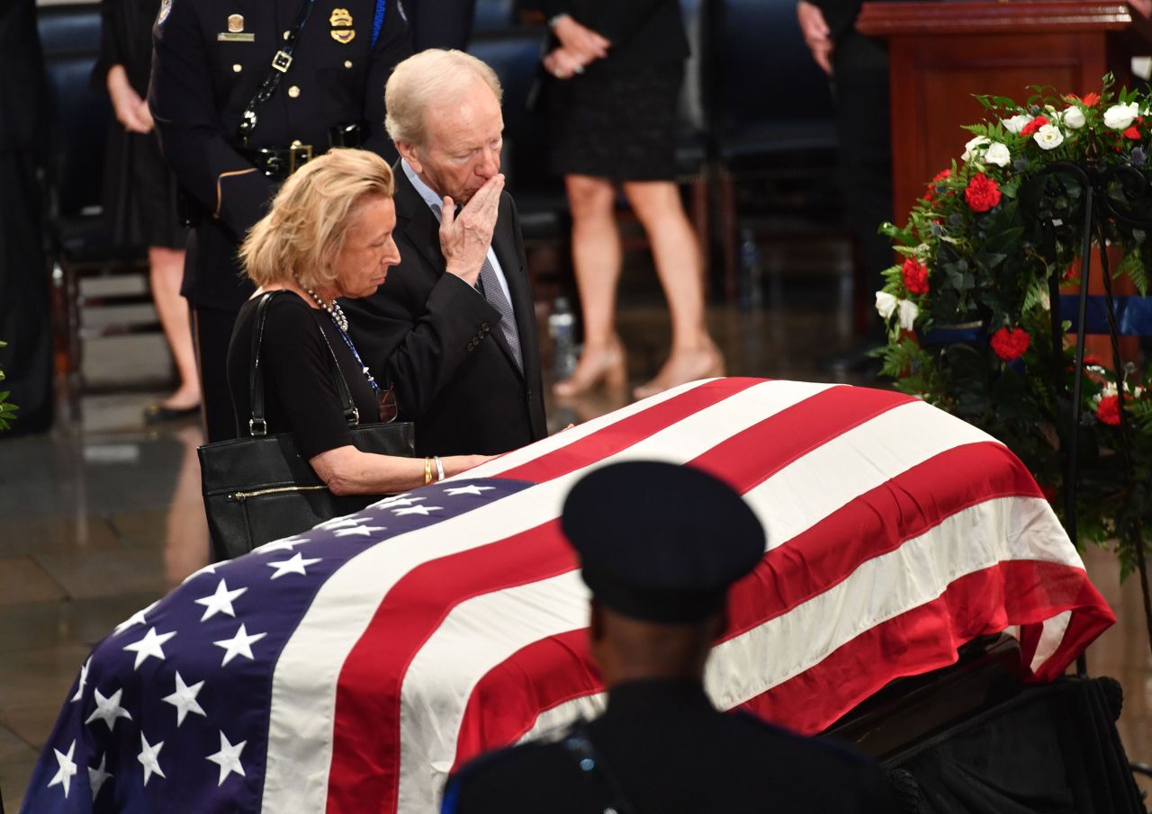 Former US Sen. Joe Lieberman and his wife, Hadassah, pay their respects during the viewing at the Capitol.