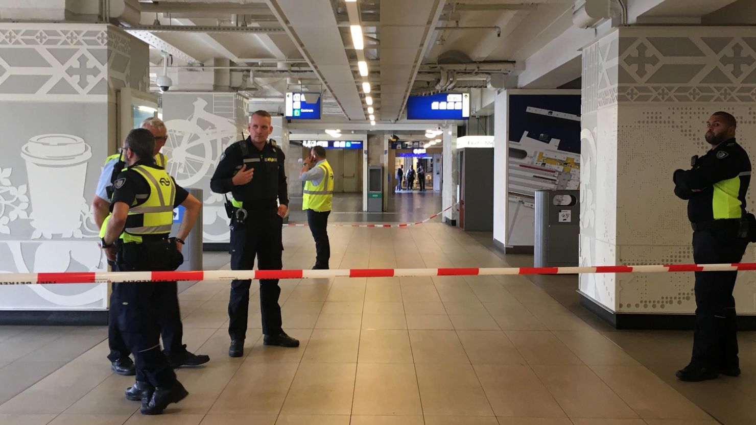 Security officials cordon off an area inside the central railway station in Amsterdam.