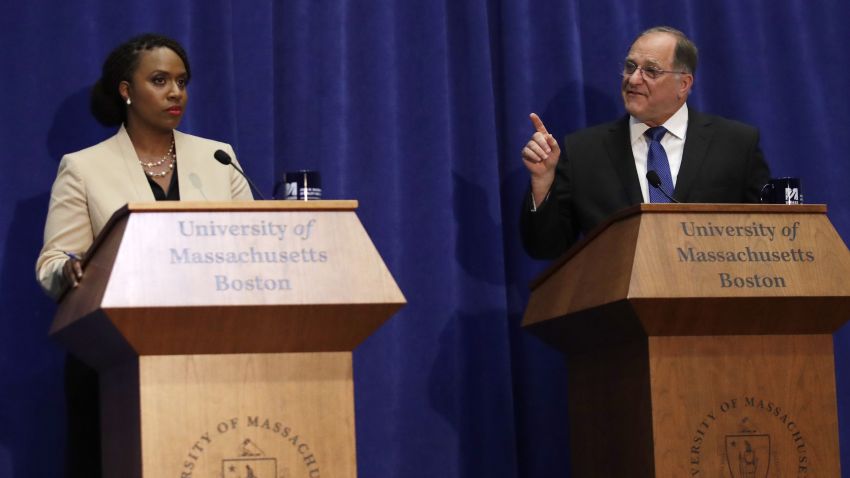 Incumbent Democratic congressman Michael Capuano, right, and primary challenger Ayanna Pressley during a debate at the University of Massachusetts, in Boston, Tuesday, Aug. 7, 2018. (AP Photo/Charles Krupa)
