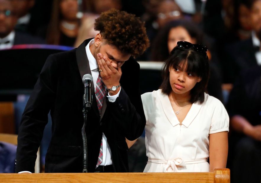 Jordan Franklin, Franklin's grandson, pauses alongside his sister Victorie while speaking at the funeral on Friday.