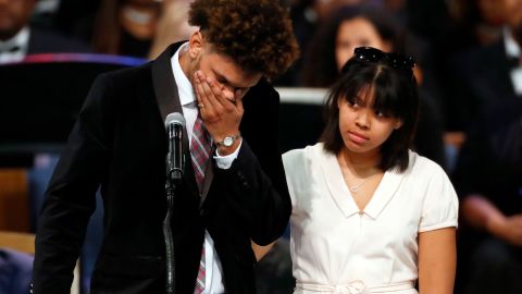 Jordan Franklin pauses alongside his sister Victorie Franklin while speaking about their grandmother.