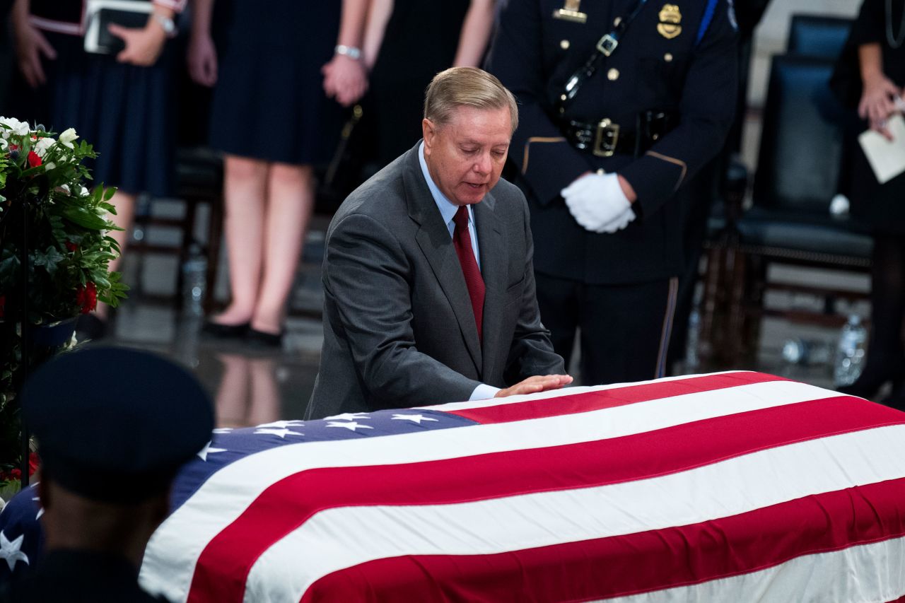 US Sen. Lindsey Graham touches McCain's casket. Graham took to the Senate floor Tuesday to give <a href="https://www.cnn.com/2018/08/28/politics/lindsey-graham-john-mccain-senate-floor/index.html" target="_blank">an emotional farewell</a> to his friend and colleague.