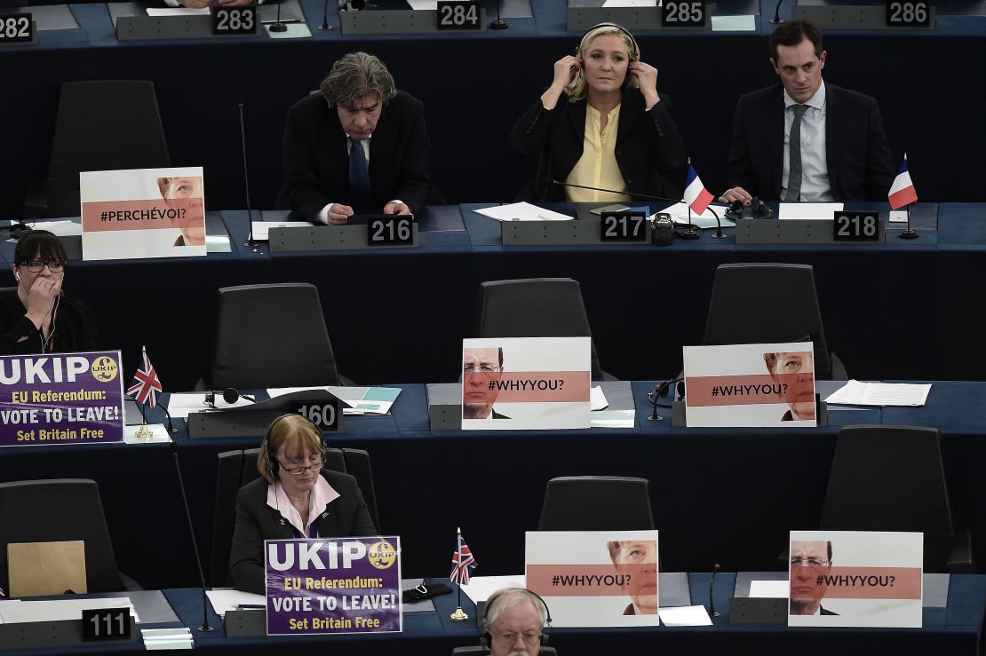 French far-right leader Marine Le Pen (back center) with other French MEPs and UKIP members surrounded by euroskeptic messages.