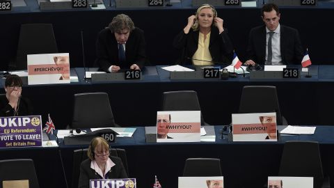 French far-right leader Marine Le Pen (back center) with other French MEPs and UKIP members surrounded by euroskeptic messages.