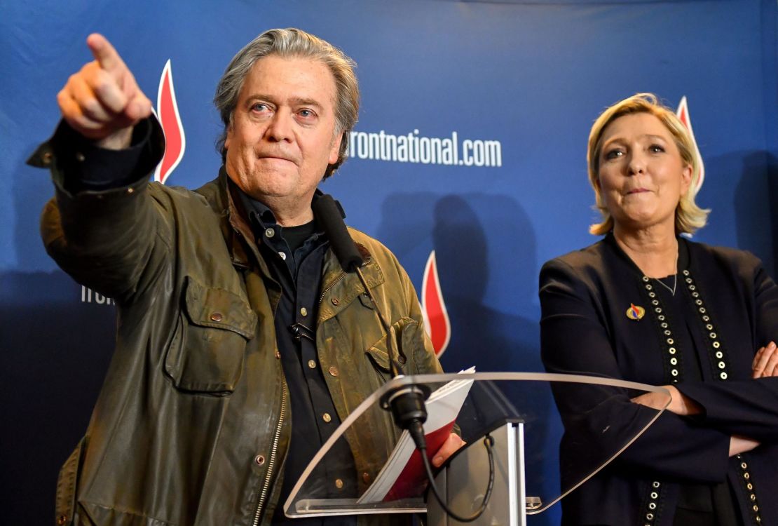 Steve Bannon, left, with France's far-right leader Marine Le Pen after giving a speech at her party's annual congress on March 10, 2018 in Lille, France.