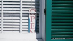 Family Meal: New Orleans Chapter 4 Post Katrina. "Open" sign in front of chef Leah Chase's restaurant Dooky Chase's