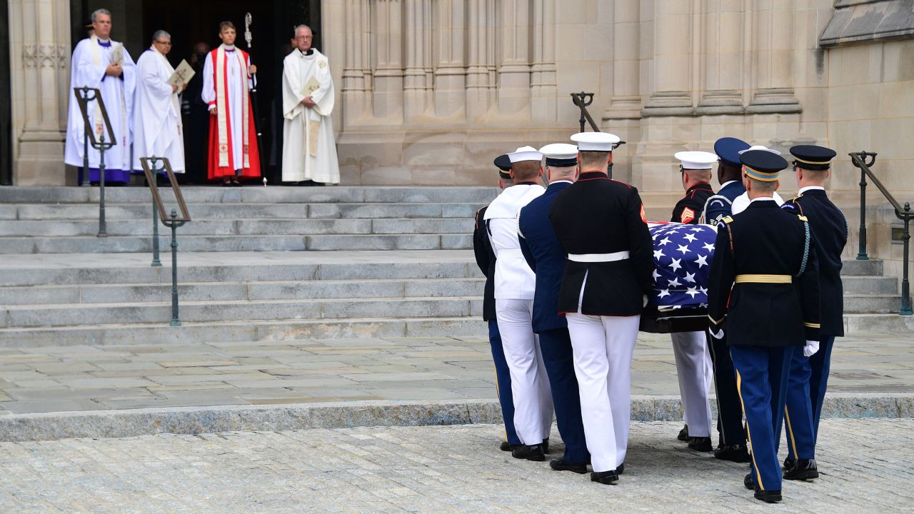 A military honor guard carries McCain's casket at the Washington National Cathedral.