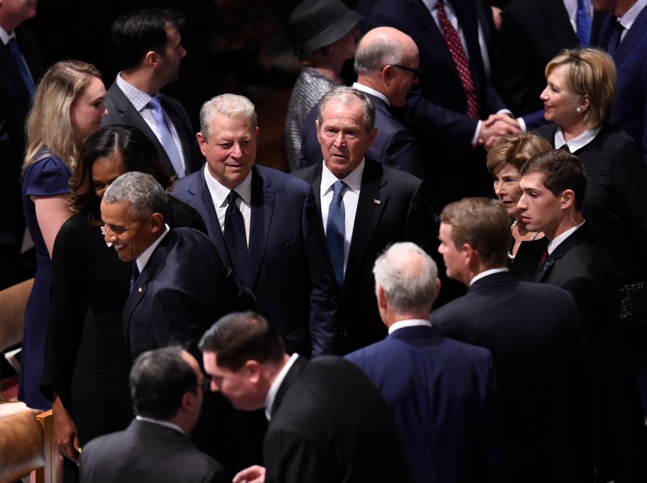 From left, former President Barack Obama, former first lady Michelle Obama, former Vice President Al Gore, former President George W. Bush, former first lady Laura Bush and former Secretary of State Hillary Clinton arrive for Saturday's memorial service.