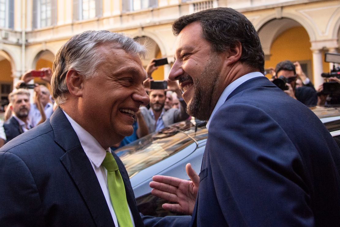 Italy's Interior Minister Matteo Salvini (R) embraces Hungary's Prime Minister Viktor Orban ahead of a meeting in Milan on August 28, 2018.