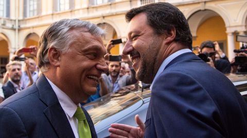 Italy's Interior Minister Matteo Salvini (R) embraces Hungary's Prime Minister Viktor Orban ahead of a meeting in Milan on August 28, 2018.
