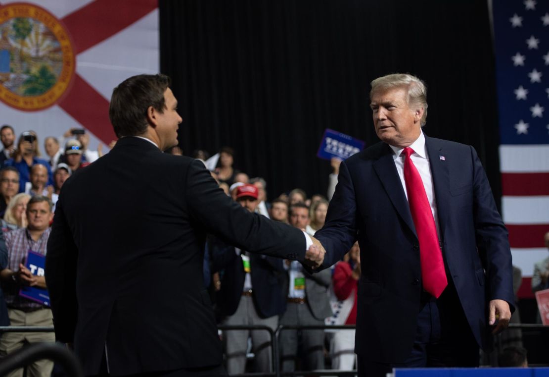 President Donald Trump shakes hands with then-Rep. Ron DeSantis in Tampa, Florida, in 2018.