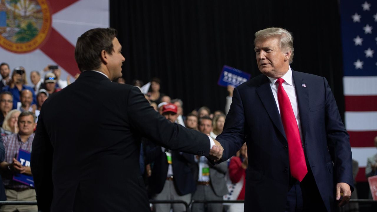 President Donald Trump shakes hands with then-Rep. Ron DeSantis in Tampa, Florida, in 2018.