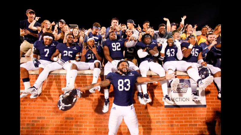 Colby Ransom of the Georgia Southern Eagles celebrates with teammates and fans after their win over the South Carolina State Bulldogs on Saturday, September 1.