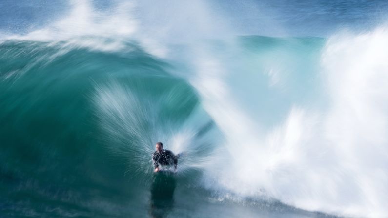 Toby Player rides a wave at Cape Solander in the Kamay Botany Bay National Park as a large swell hits the east coast of Australia on Thursday, August 30.