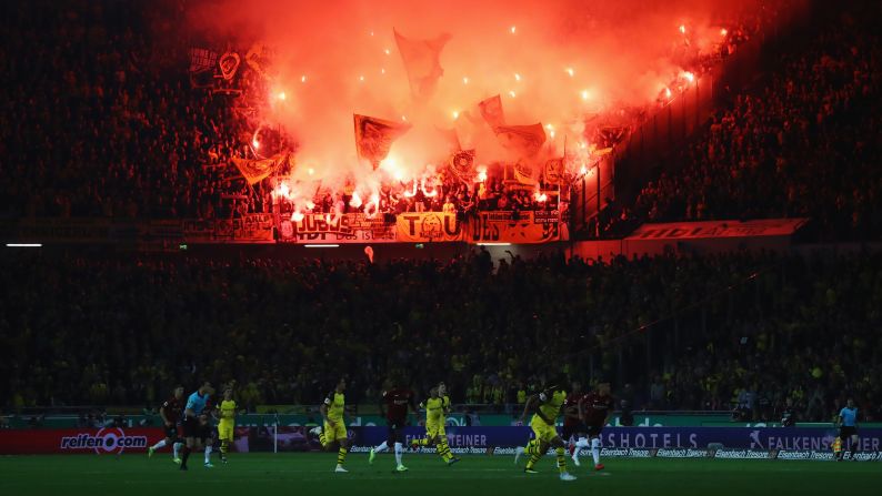Borussia Dortmund fans light flares during the Bundesliga match with Hannover 96 on Friday, August 31.
