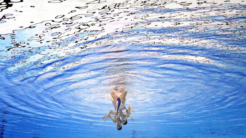 Japan's Yukiko Inui, left, and Megumu Yoshida, right, compete in the synchronized swimming duets on Tuesday, August 28.