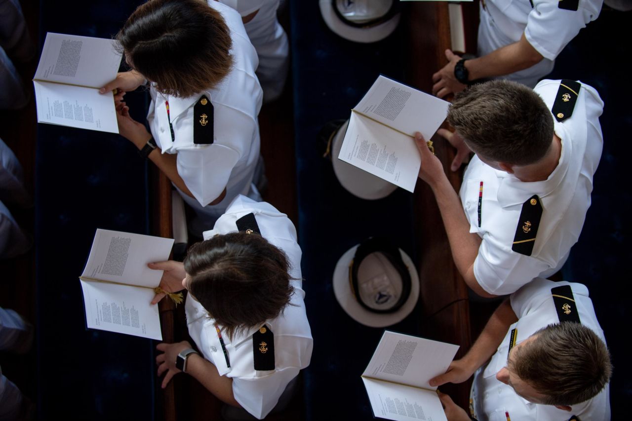 Sailors participate in Sunday's funeral service.