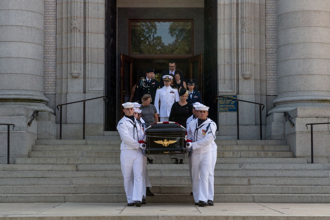 McCain's casket is brought out of a chapel during a private funeral service at the US Naval Academy.