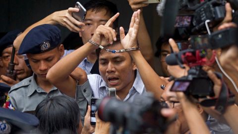 Kyaw Soe Oo speaks to journalists as he leaves court on Monday. 