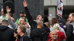 A man raises his arm in a Heil Hitler salute towards heckling leftists at a right-wing protest s on August 27, 2018 in Chemnitz, Germany. 
