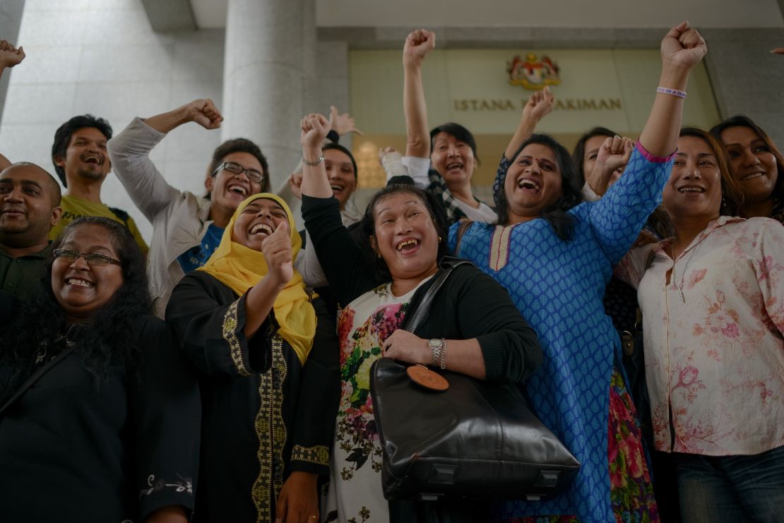 Transgender activists celebrate outside the court of appeals in Putrajaya in 2014, when three Malaysian transgender women on November 7 won their landmark bid to overturn an Islamic anti-cross dressing law.