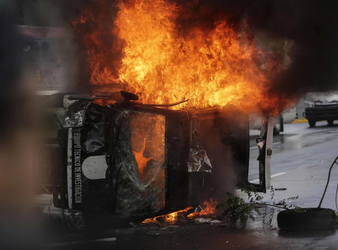 A police vehicle was overturned and set on fire by demonstrators during anti-government protests in Managua, on September 2, 2018.
